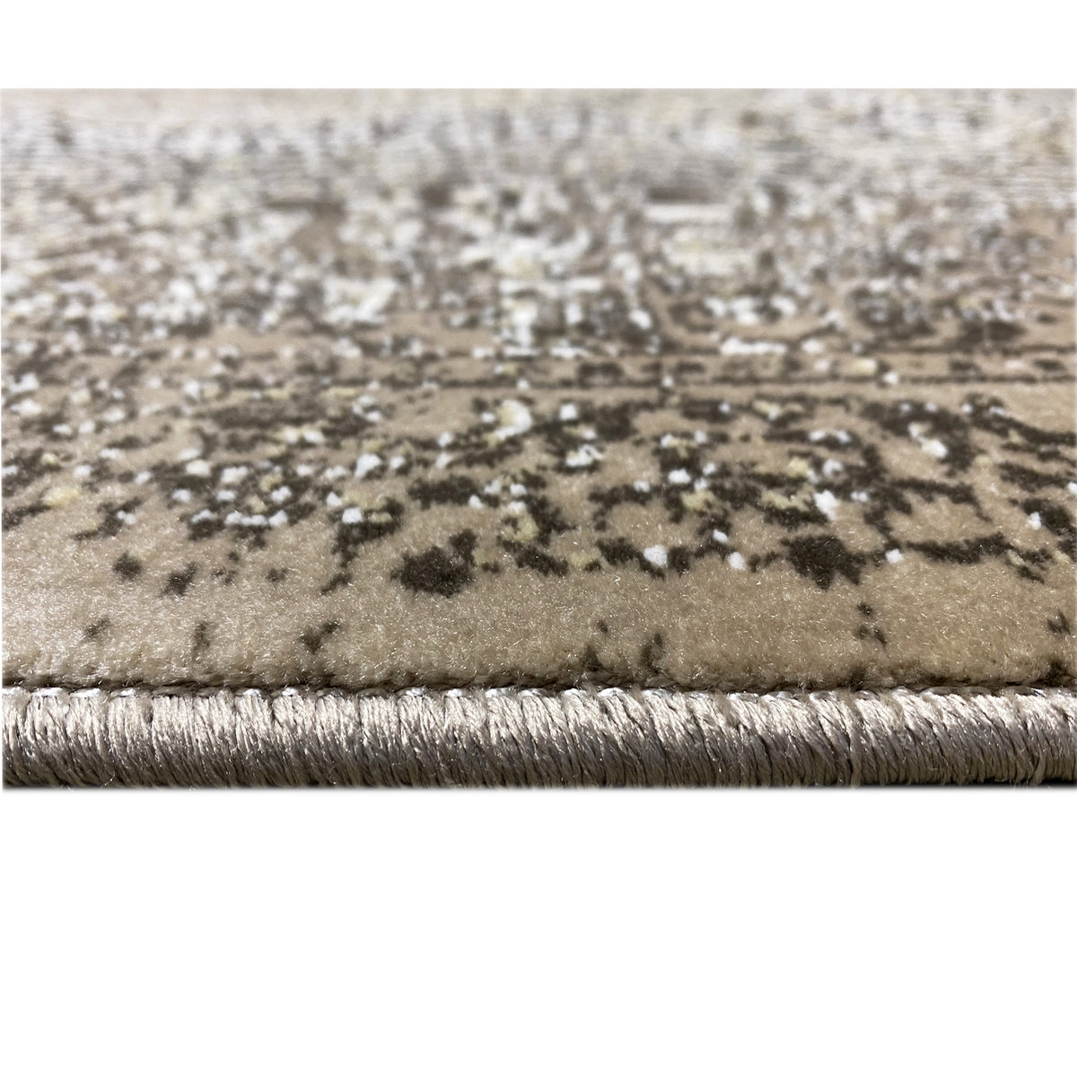 Carpet edge detail: bound hem with fringe, silver/light on dark gray