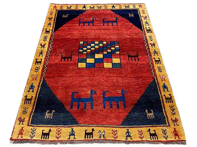 Gabbeh rug: red field with blue border and geometric pattern, 167x119 cm