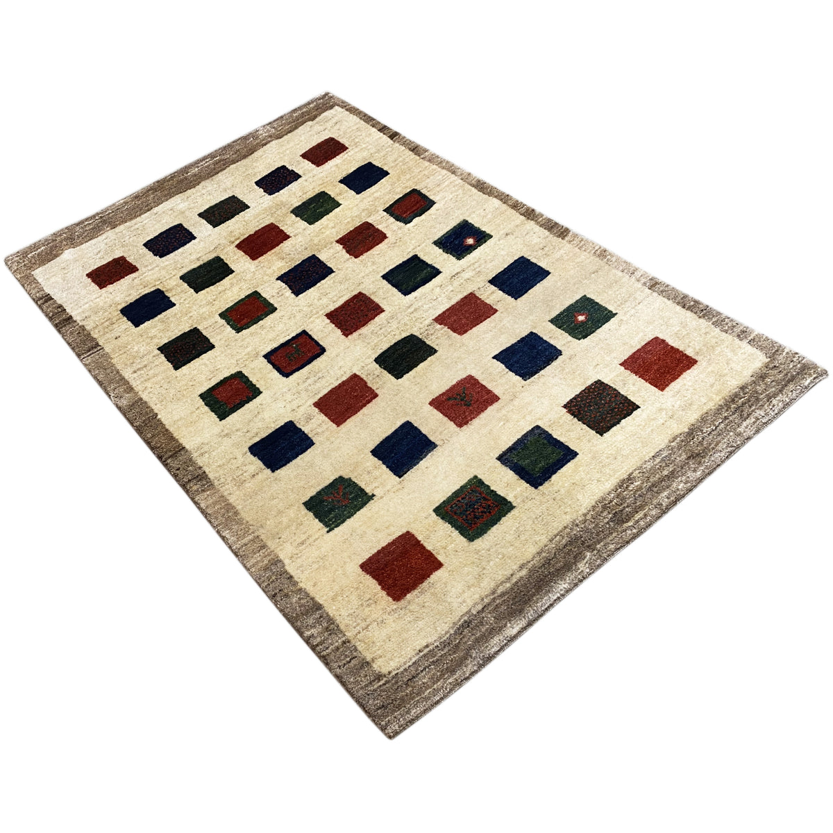 Gabbeh rug with diamond and square motifs in dark blue, red, and green on beige