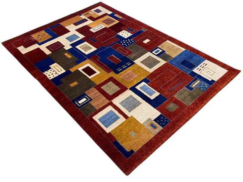 Oriental rug with a checkerboard patchwork design in red, blue, beige, mustard yellow and brown