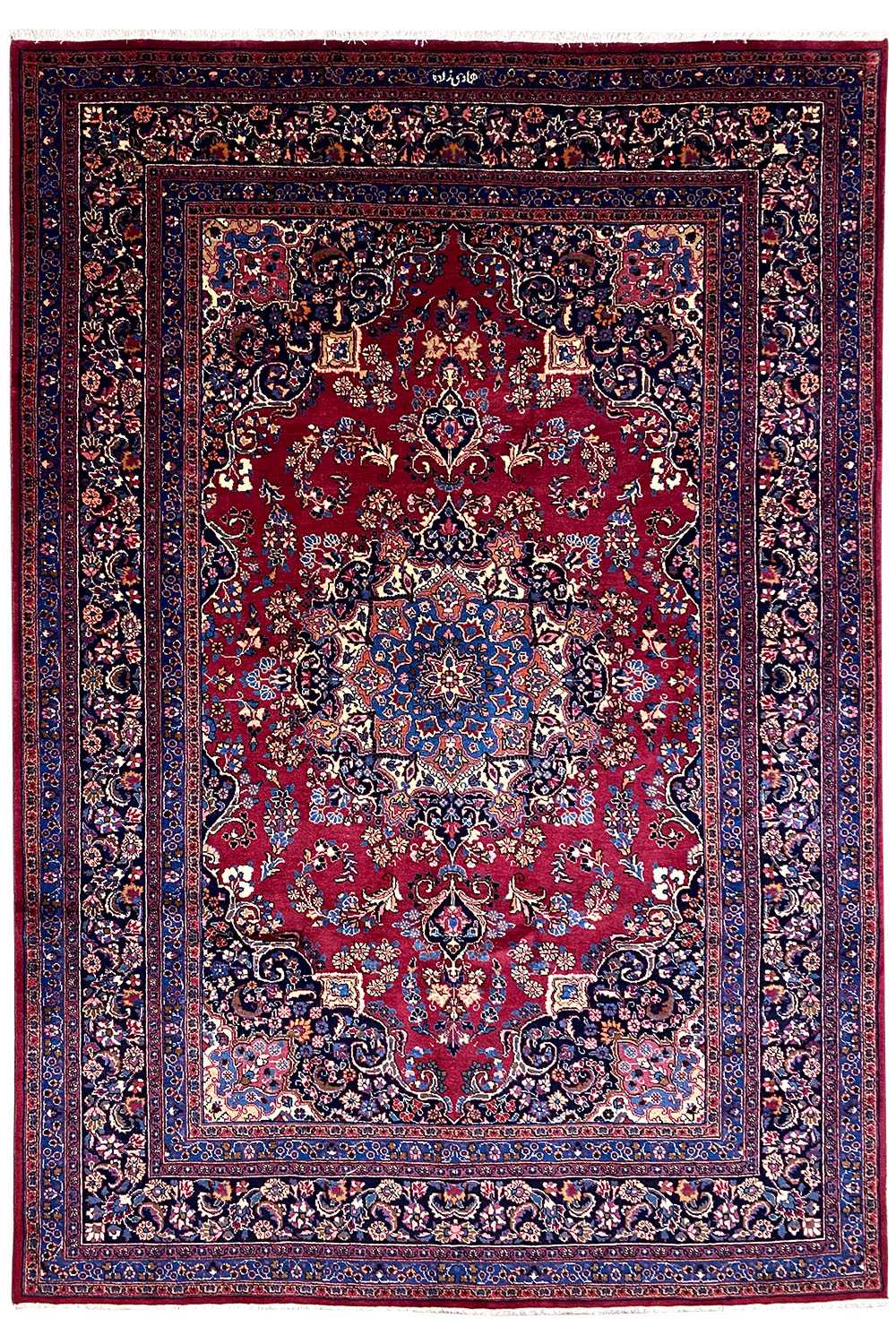 Oriental rug with a red pattern and blue border, 296×199 cm