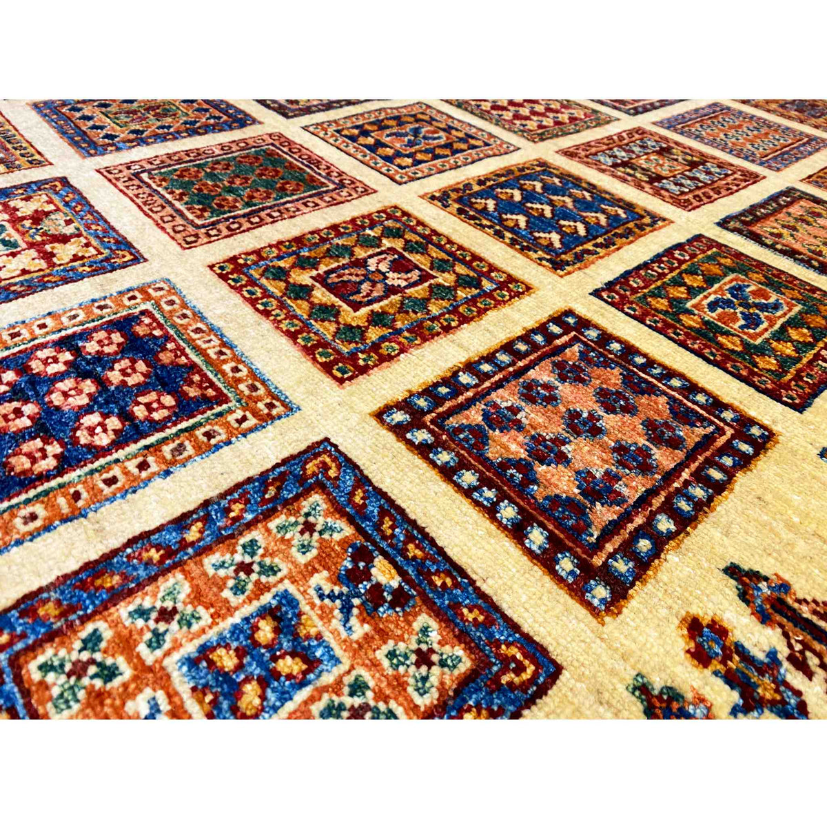 Detailed view of Afghan Khorjin rug: colorful tile motifs in a geometric diamond pattern