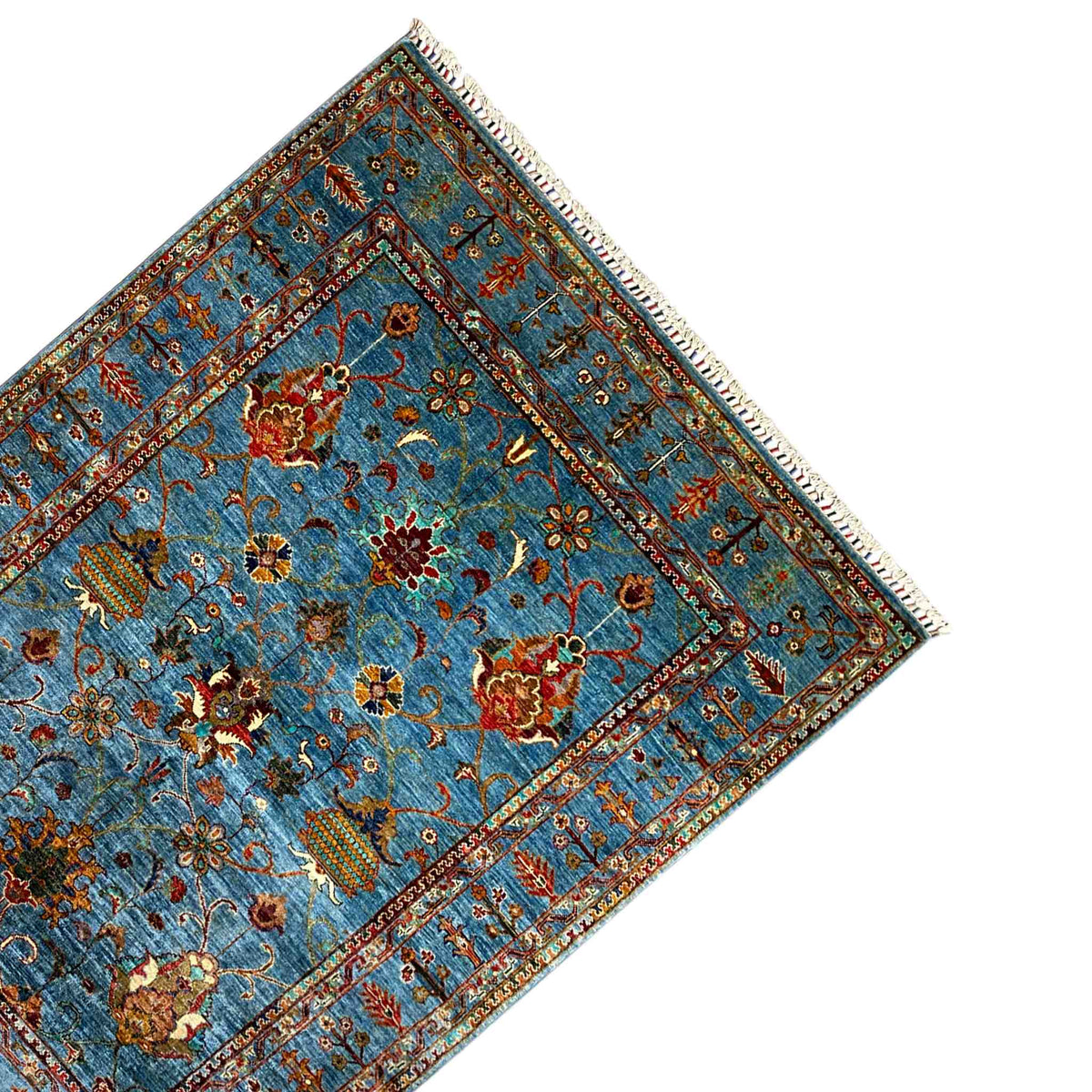Khorjin rug, blue, diamond-shaped motifs, decorative border, fringe at the corner