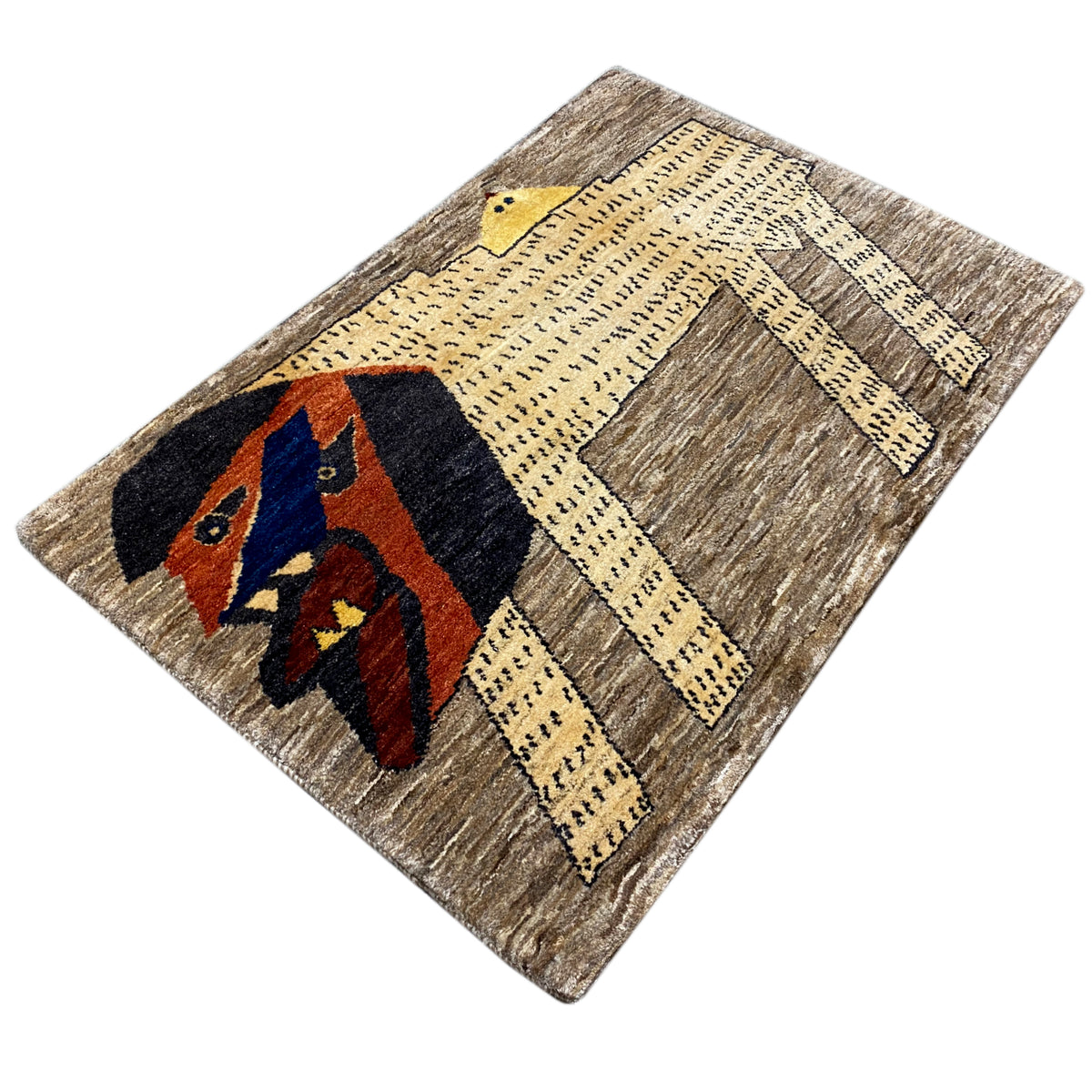 Gabbeh rug with a diagonally positioned lion motif in dark blue, red, and yellow