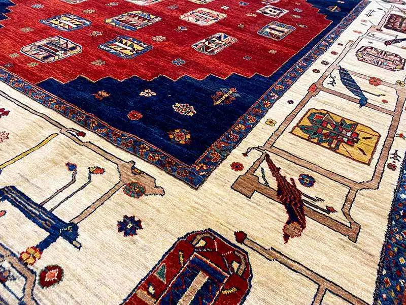 Carpet detail: red and blue areas with delicate beige and multicolored ornaments