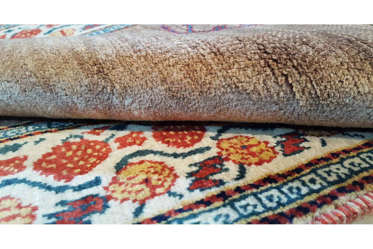 Oriental rug roll with a short pile and visible edge