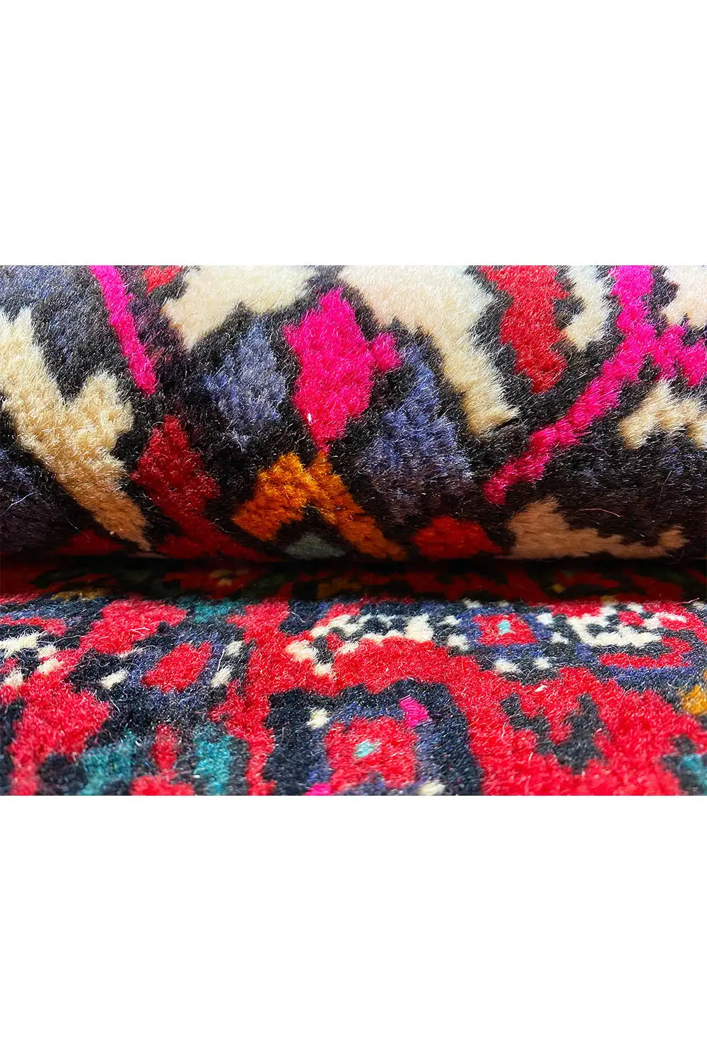 Hamedan oriental rug detail of pile and ornaments, red, blue, yellow, pink