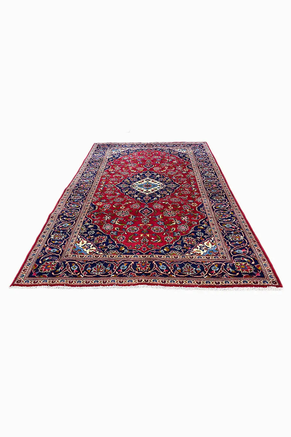 Rectangular rug with a red background, blue border, and multicolored ornaments