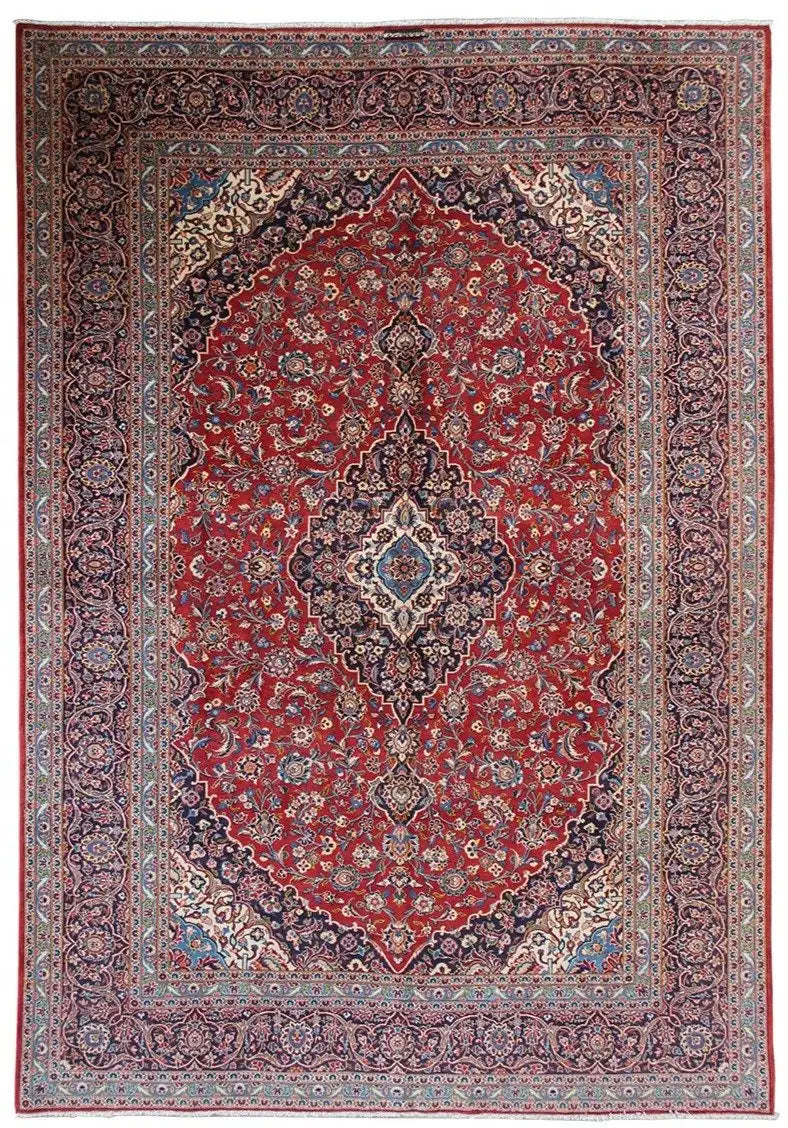 Red Keshan oriental rug with medallion pattern and blue border, rectangular