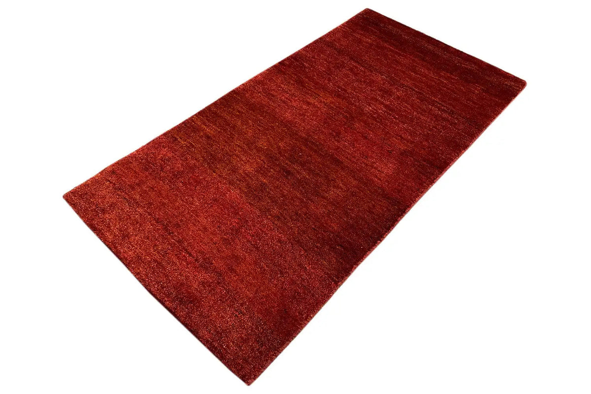 Carpet, rust-red to reddish-brown, rectangular spread-out area with fine grain
