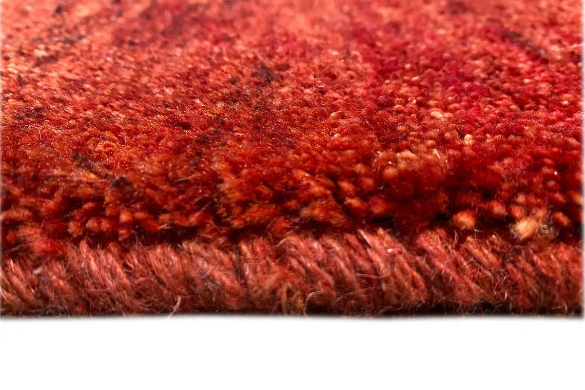Carpet fringe along the lower edge, red, dense, and short-fibered