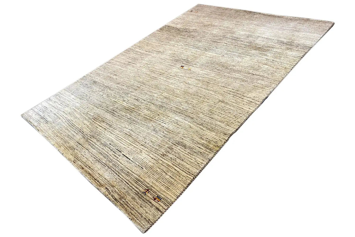 Rug in an angled view: light beige background with striped pattern elements