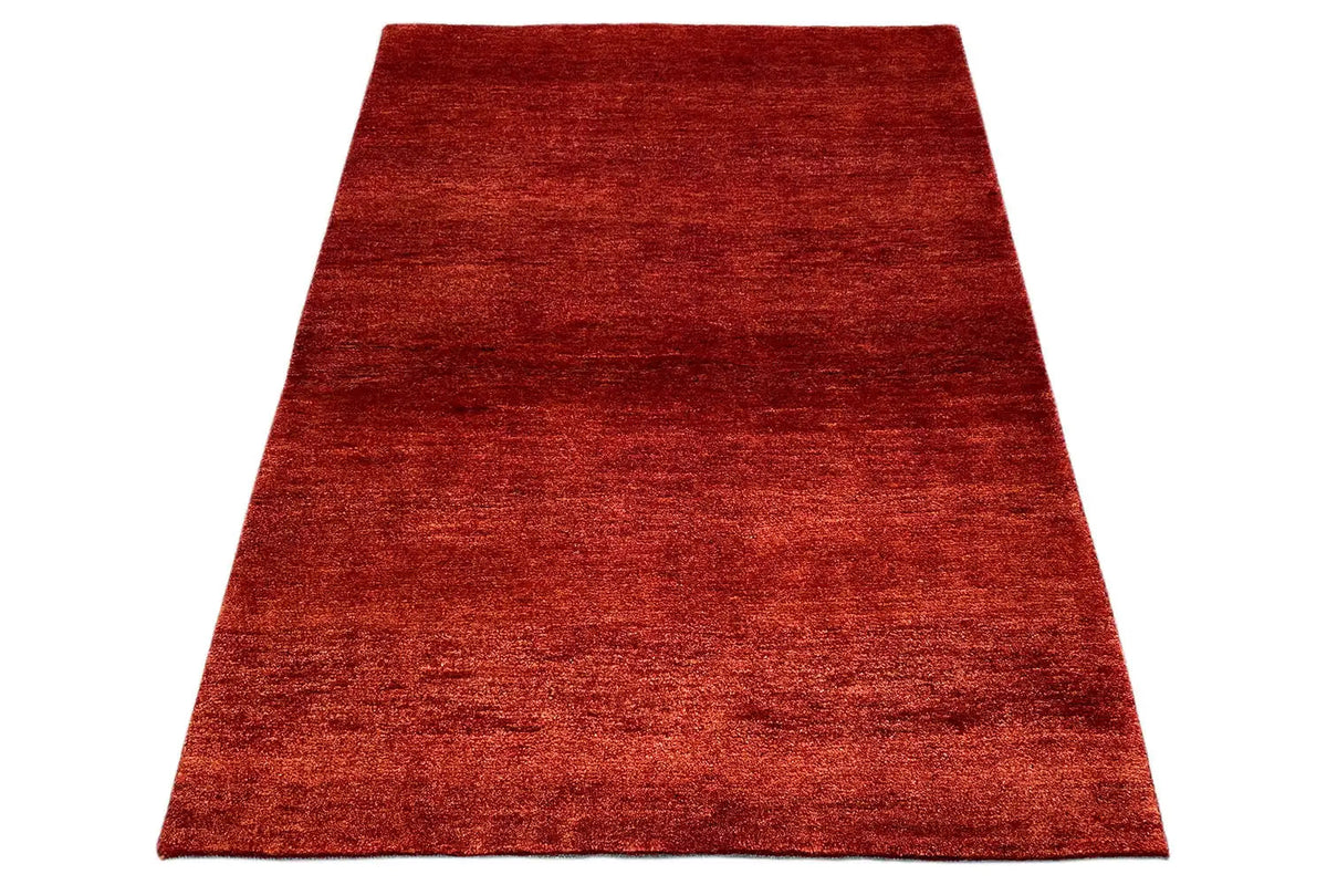 Gabbeh rug 151x106 cm, red woven rug in angled view, rectangular