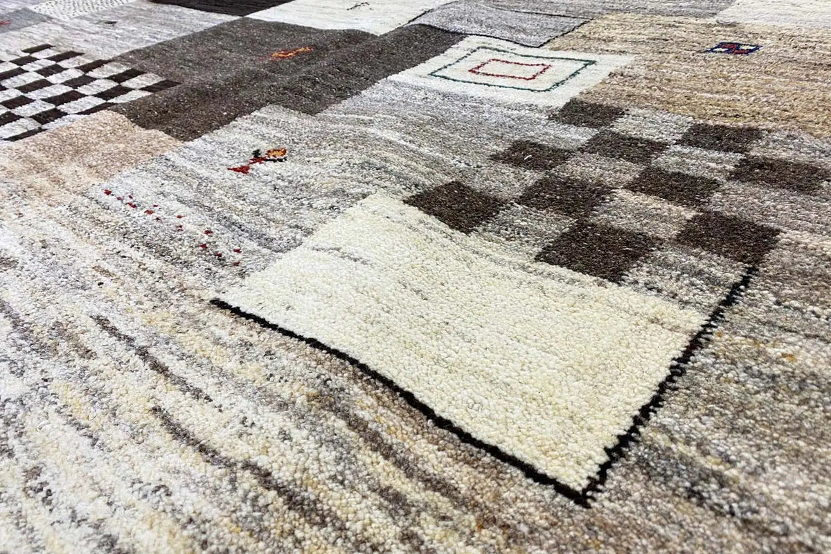 Gabbeh rug with geometric patterns in gray, beige, and black