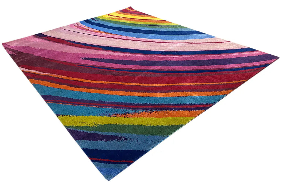Multicolored rug with a striped pattern, photographed from a corner