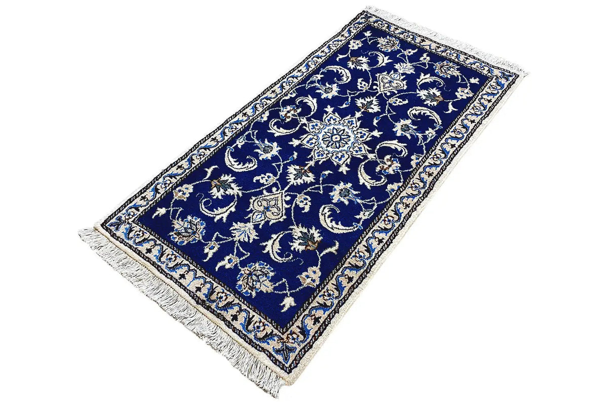 Nain oriental rug, rectangular, blue with stylized floral motifs and fringes