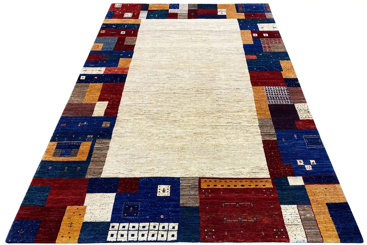 Gabbeh rug with a white rectangle in the center and a colorful patchwork border