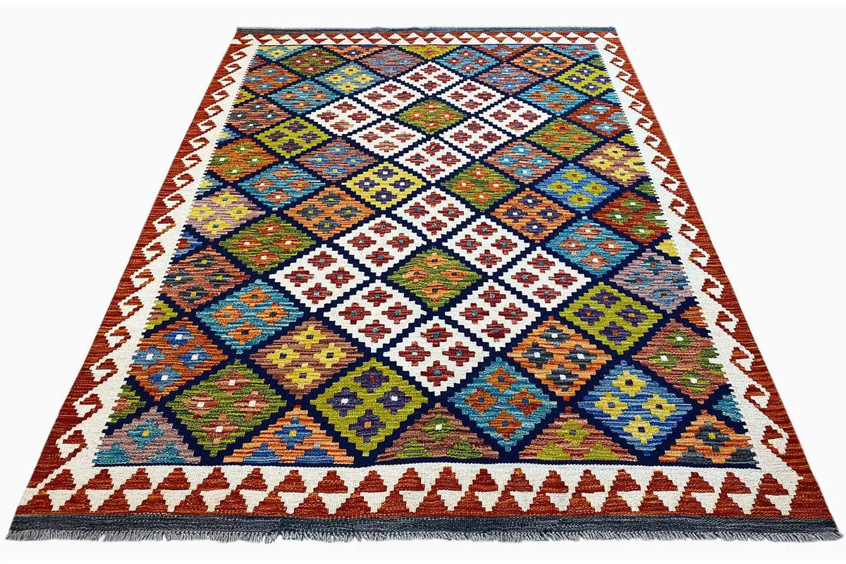 Afghan kilim with a geometric patchwork pattern, colorful border, and fringes