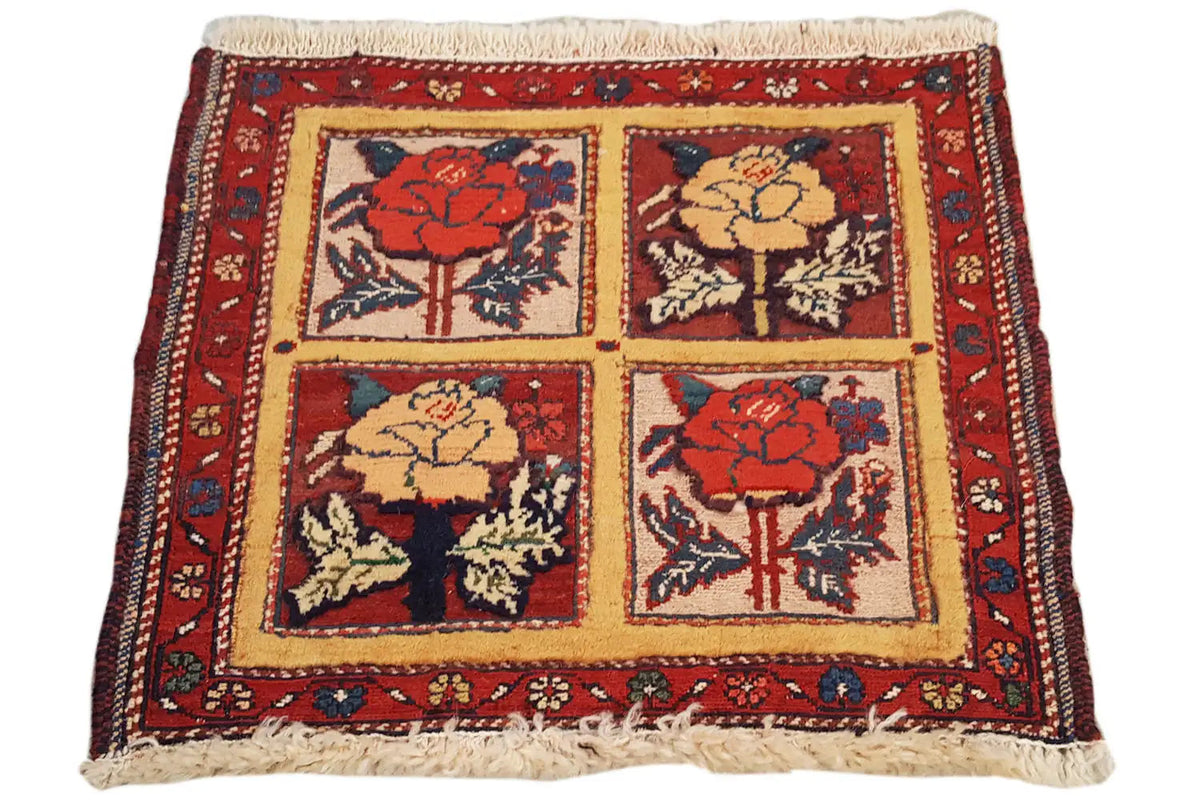 Cushion-cover rug with a square pattern, red border and fringes, 48x42 cm