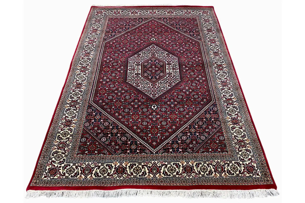 Bordeaux rug with a gray border and white fringed edge