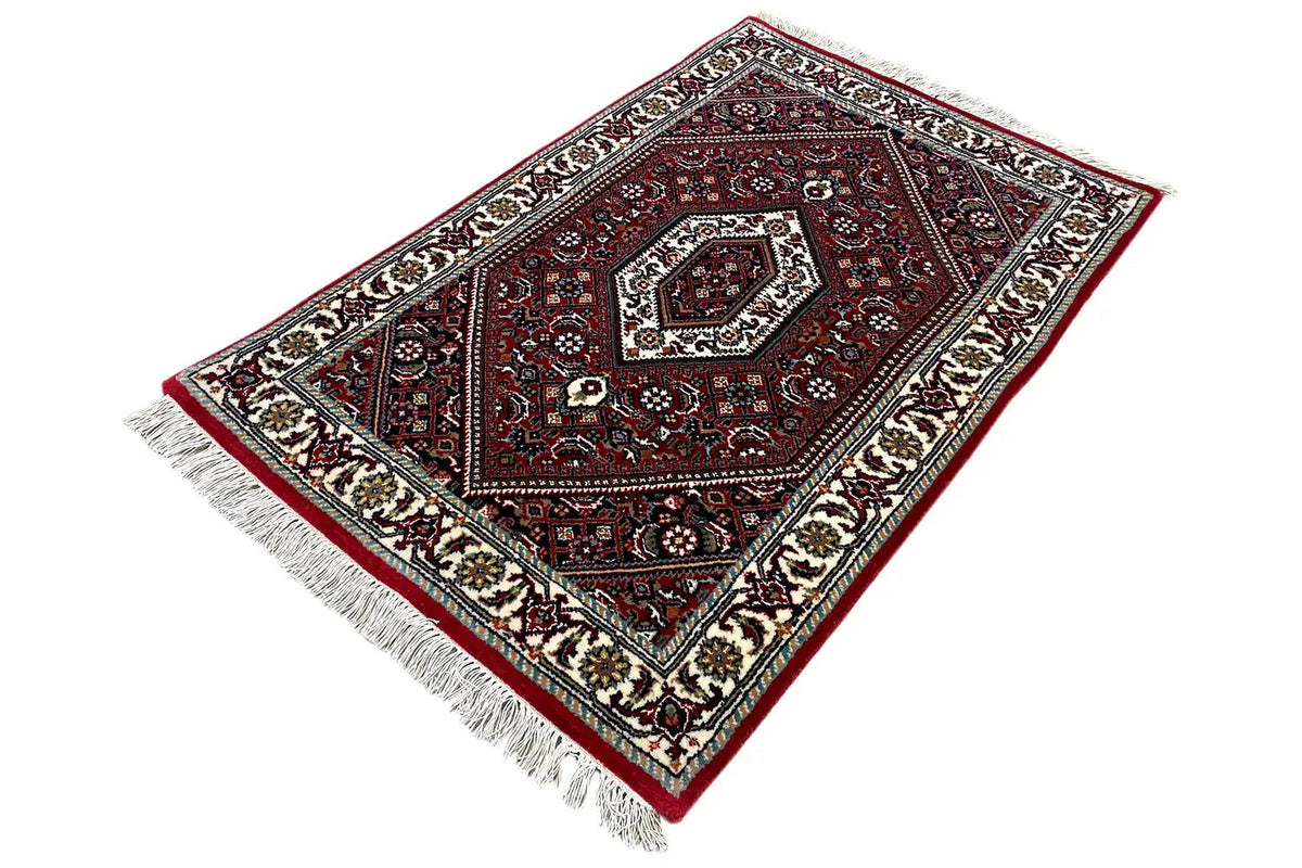 Bidjar rug (94×62 cm): angled view with a central medallion and multicolored border