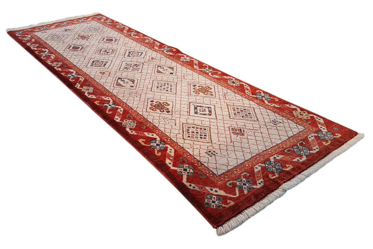 Exclusive Qashqai Oriental rug, beige field with red borders, fringes
