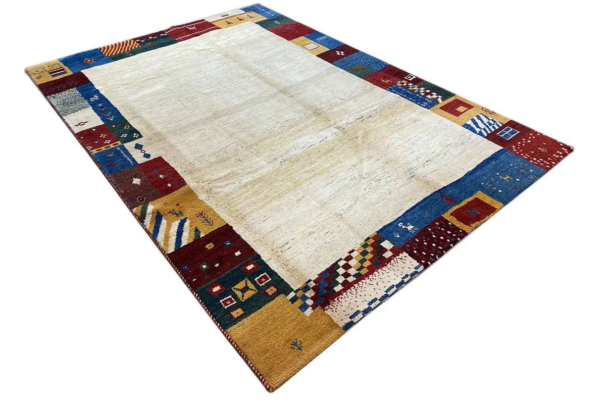 Gabbeh rug, diagonal: cream-colored center with colorful diamonds and squares around the edge