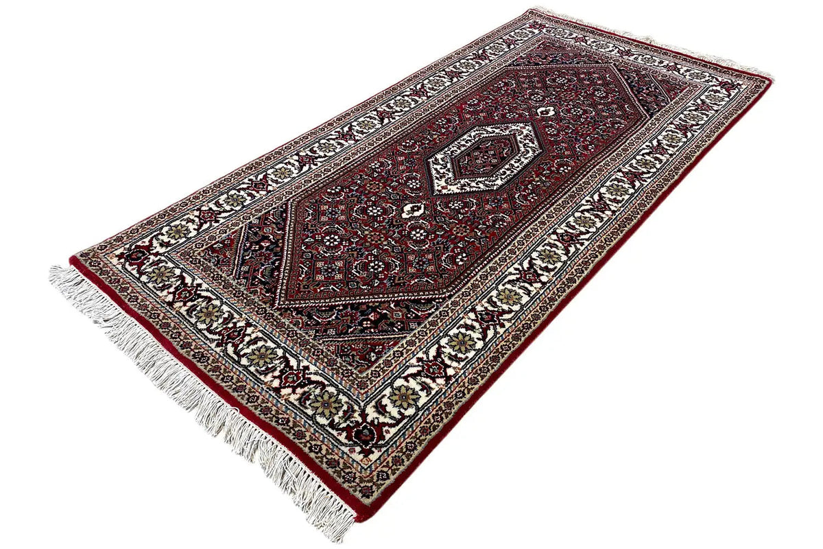 Bidjar rug 144x71 cm with a distinctive central medallion and fringe along one edge