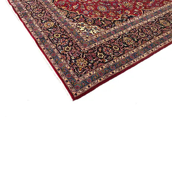 Carpet edge with a red border, dark trim, and delicate ornamental frame