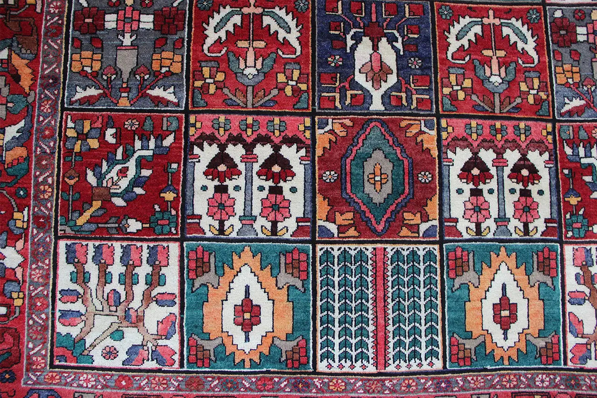 Oriental rug with diamond and medallion motifs in red and turquoise, 315×220 cm