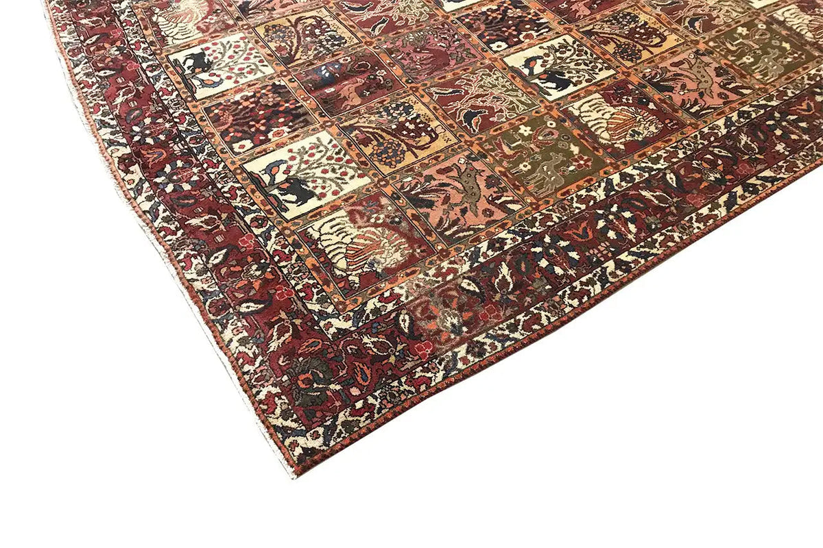 Oriental rug with geometric panels and ornaments in red, cream, and dark green