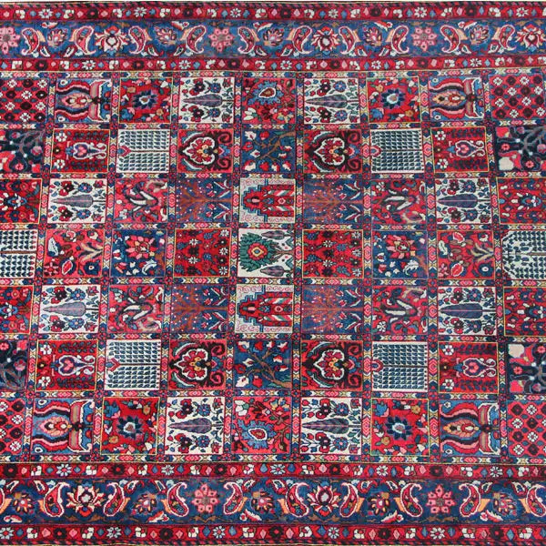 Bakhtiari rug (320x214 cm) close-up: red, blue, and white squares with floral ornaments.