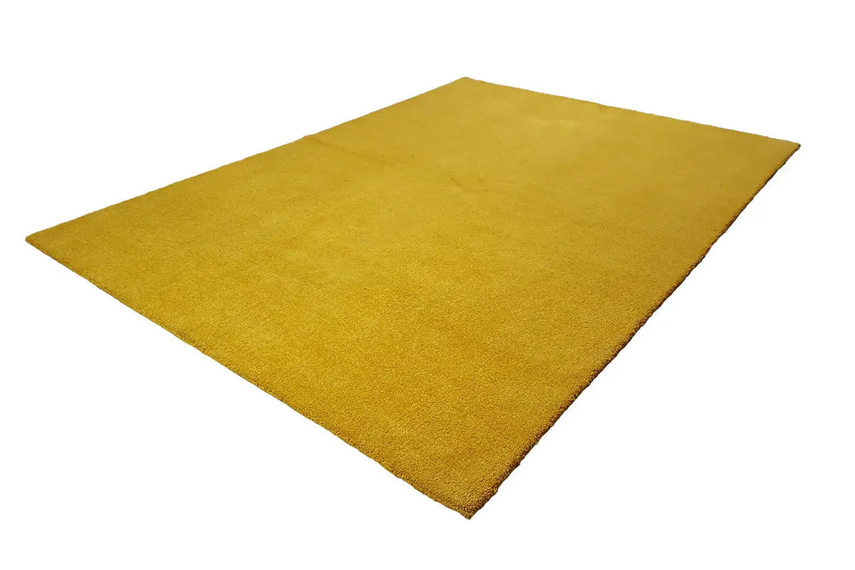 Mustard yellow Gabbeh rug, lying diagonally