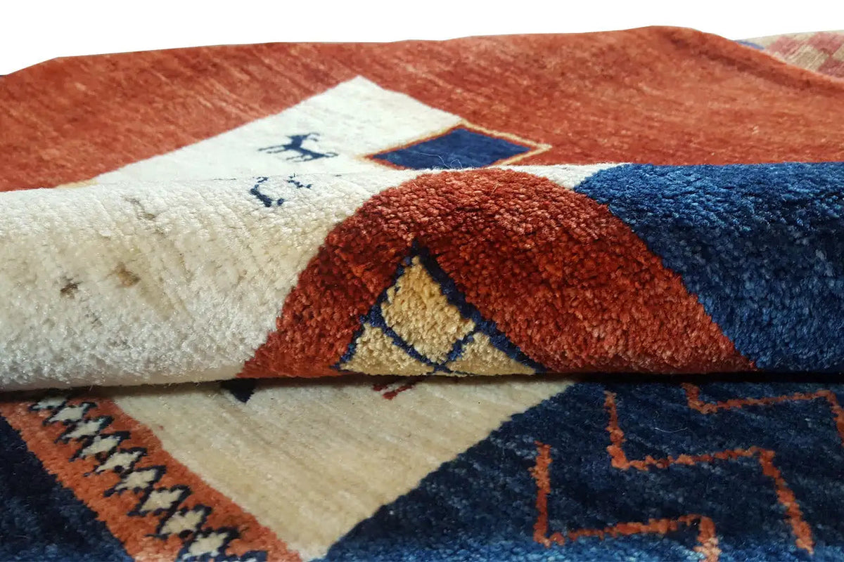 Gabbeh-Lori rug: close-up of the woven texture with short pile over a geometric pattern