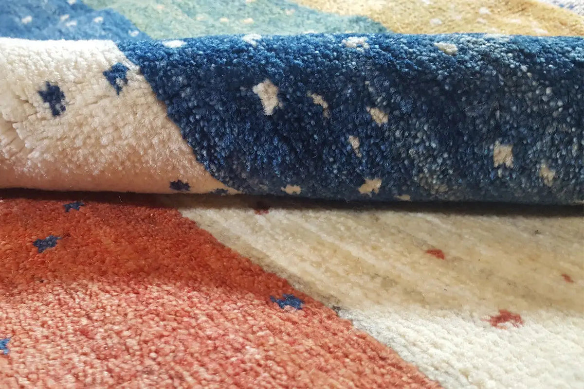 Carpet-pile detail, soft texture, and stripes in blue, red, and cream