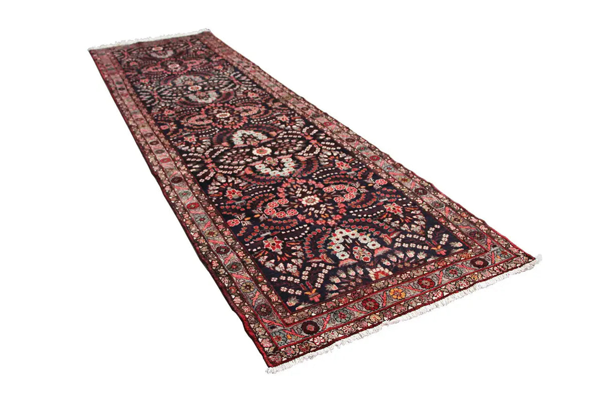 Hamadan runner, flat-woven, dark blue with red-and-beige patterns and fringes along the edges