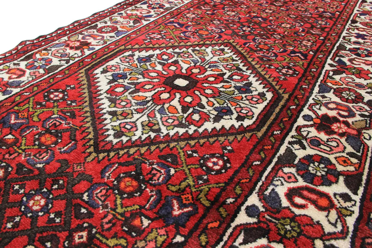Close-up: red table runner with a midfield pattern and decorative trim