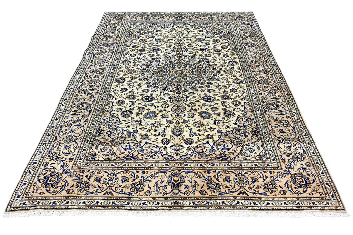 Keshan rug with borders and medallion design, intricately detailed blue and cream pattern