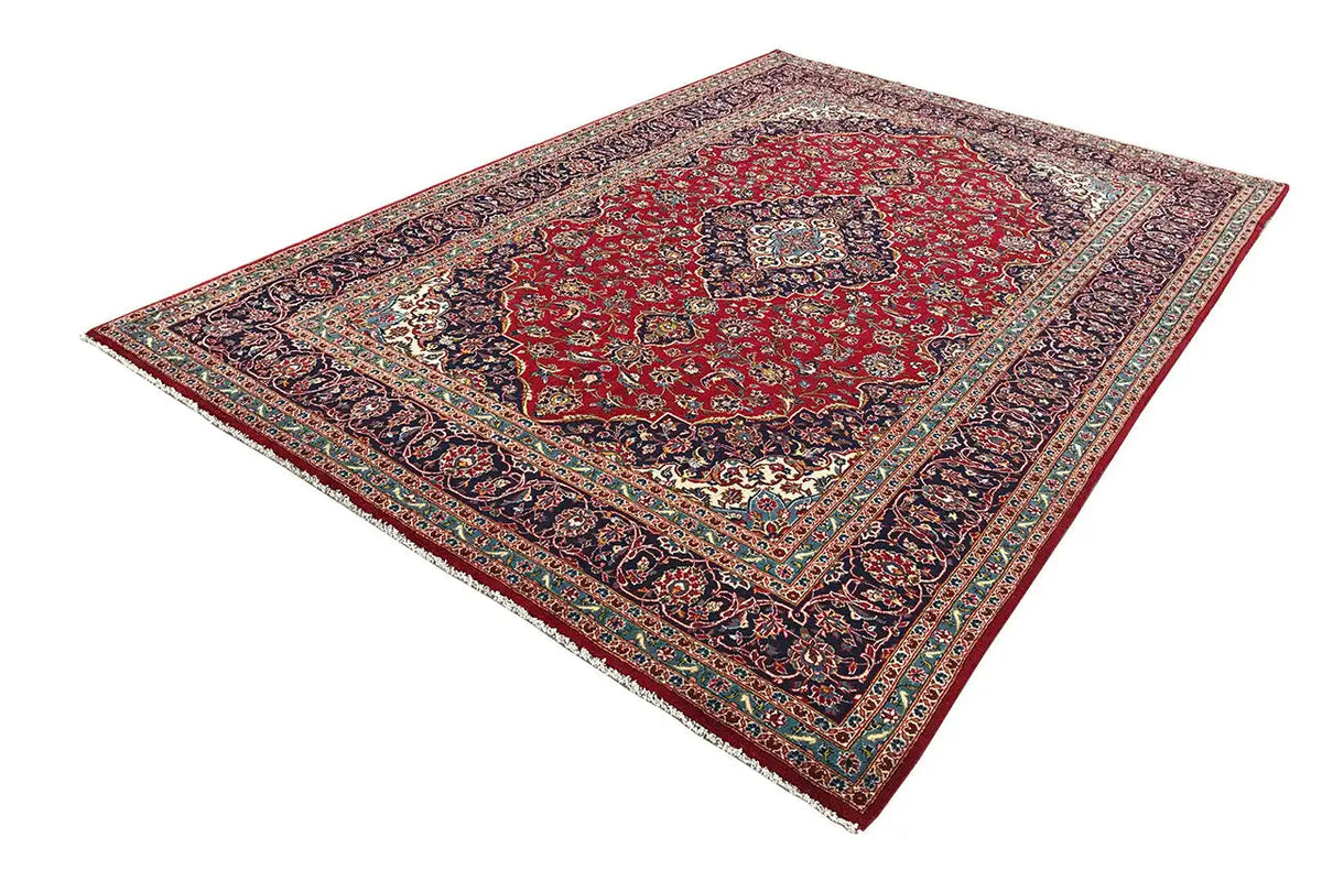 Keshan rug in red with a geometric border and floral ornaments, 353x247 cm