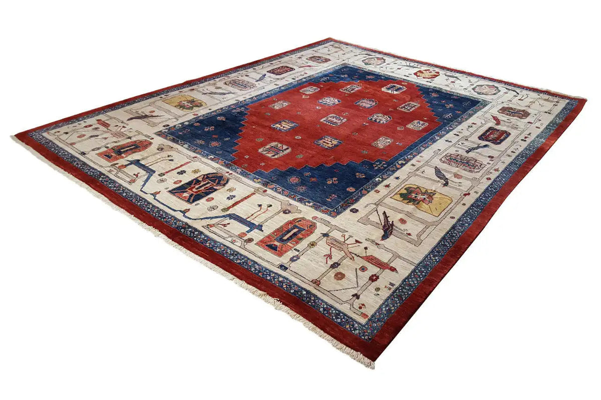 Oriental rug spread diagonally, red central field with blue border and edging