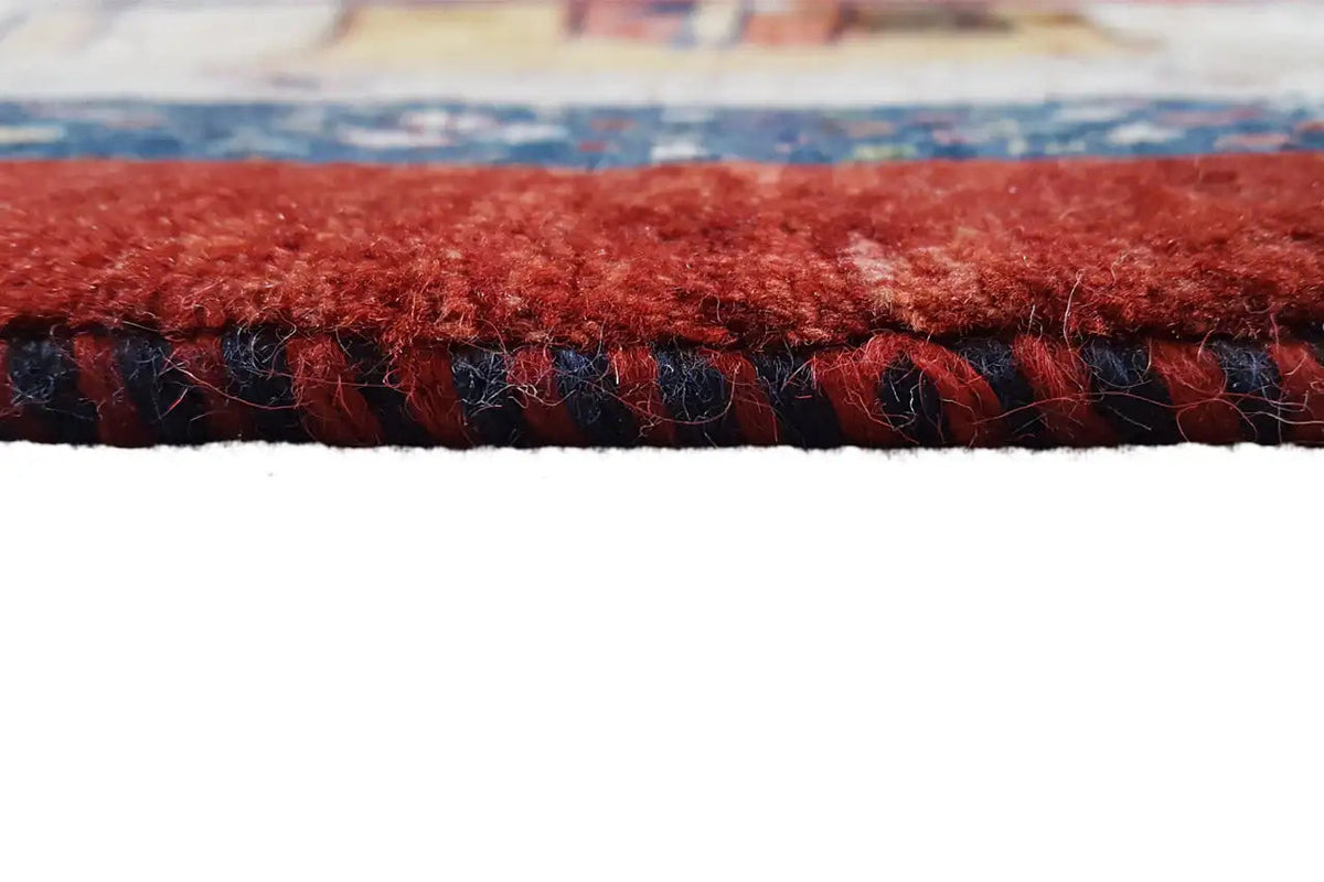 Rug edge with dense pile and red fringes, bordered by a dark trim