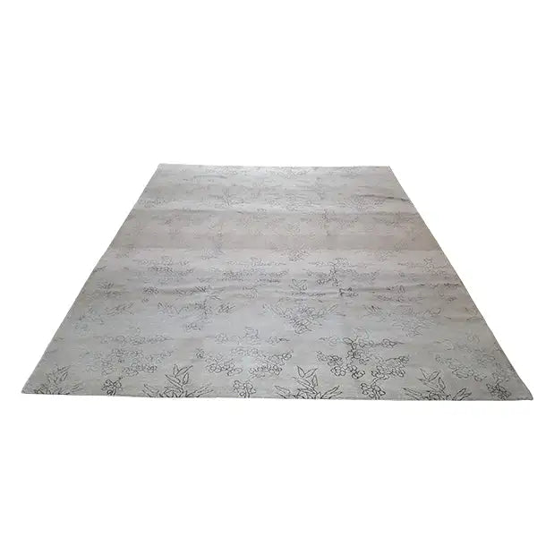 Designer rug with Bo Hamsa: light gray rug with floral ornaments, laid flat