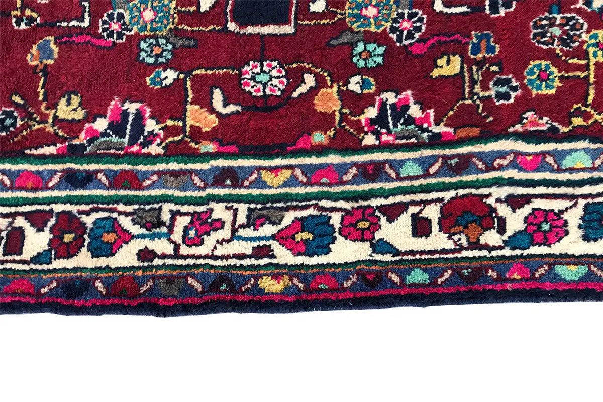 Hamadan runner lower edge with red area, multicolored decorative trim, and patterned border