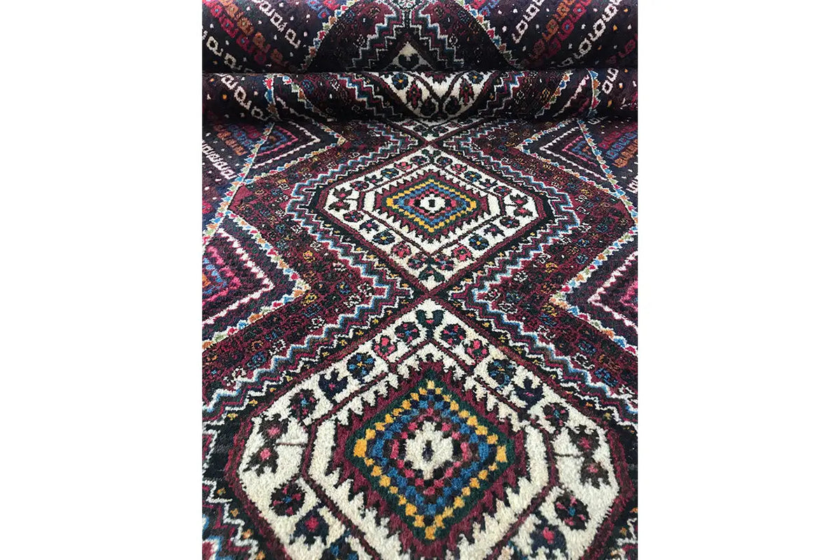 Runner with a central diamond motif and surrounding zigzag lines, dark background