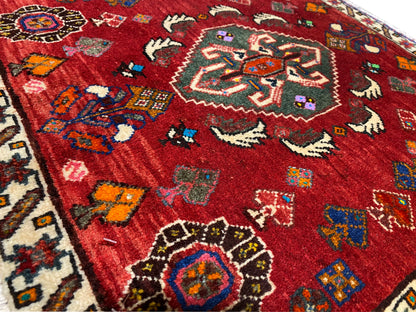 Close-up of Poshti rug 58x57 cm, red pattern with animal and floral motifs