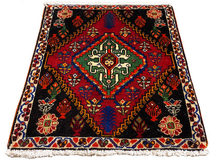 Poshti rug 56x56 cm in top view, black background with a red border pattern
