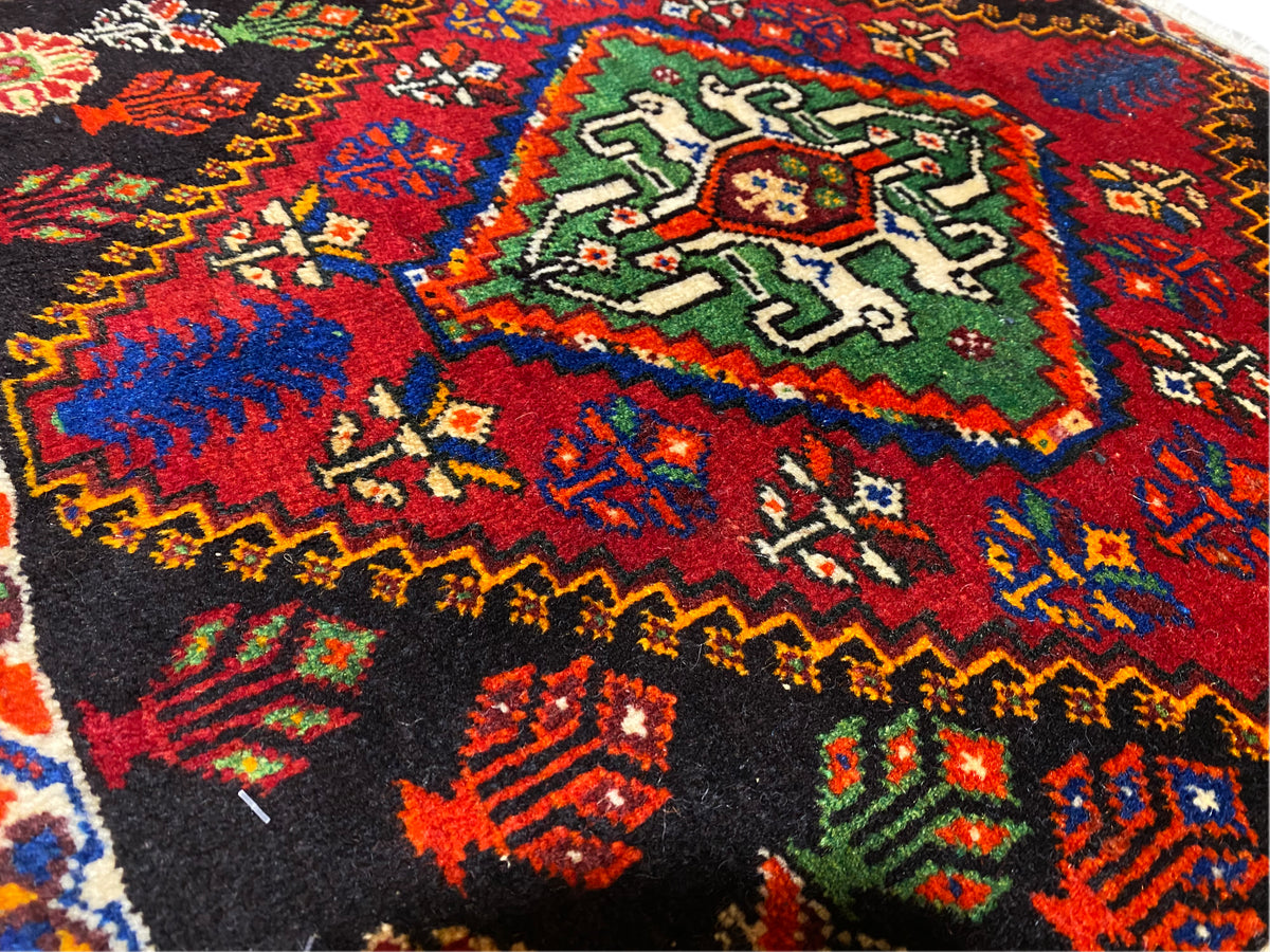 Poshti rug 56x56 cm close-up of the central field with green and red ornaments
