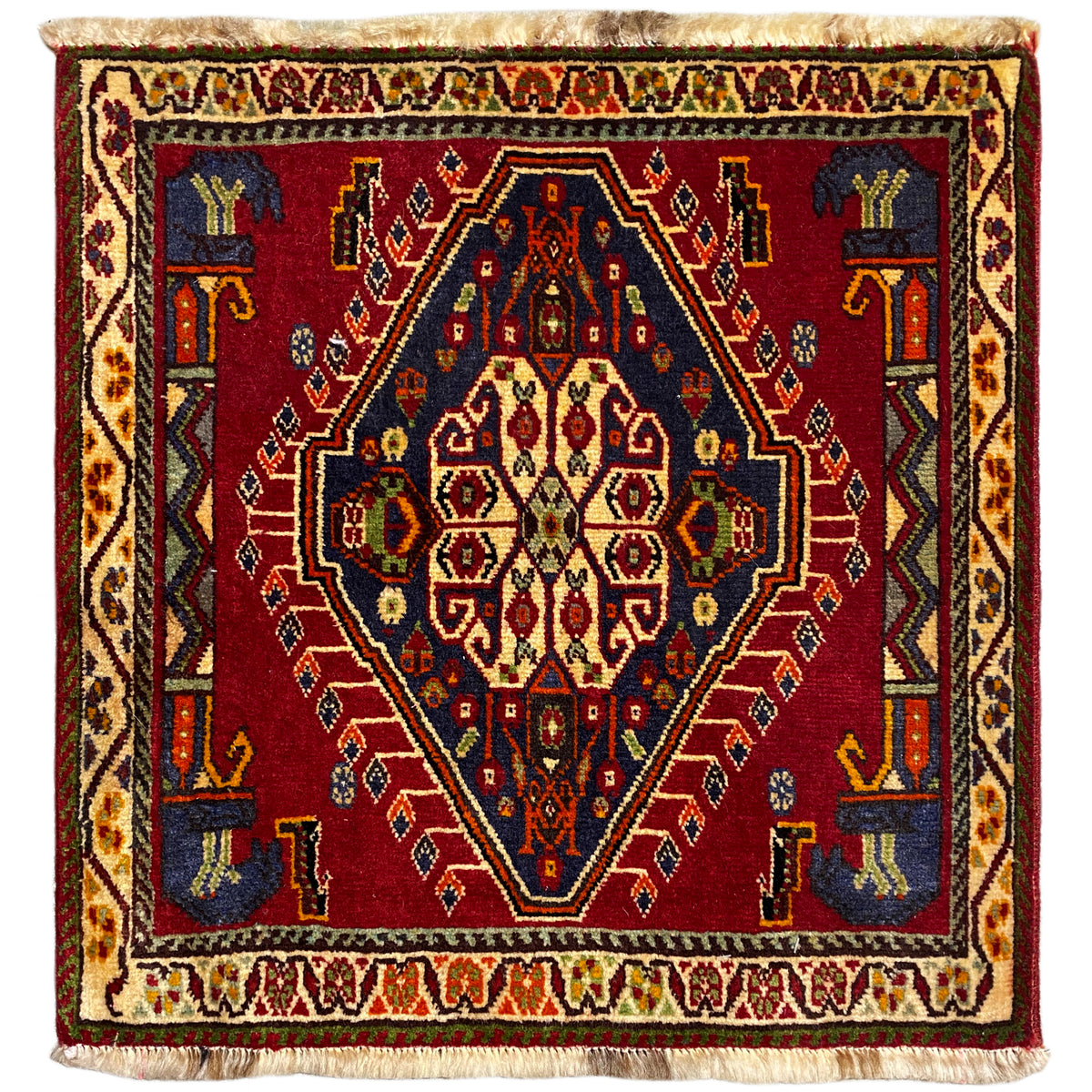 Poshti rug (59×61 cm) with a red all-over pattern, multicolored borders, and fringes