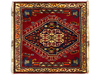Poshti rug (59×61 cm), square, with a red ornamental rug motif and light-colored fringes