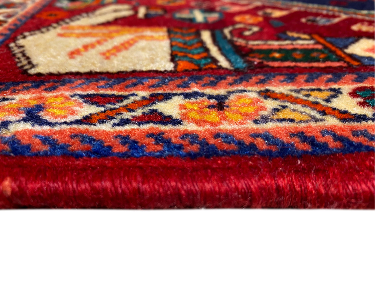 Poshti rug 64x64 cm, close-up of the pile and border, red and blue with multicolored accents